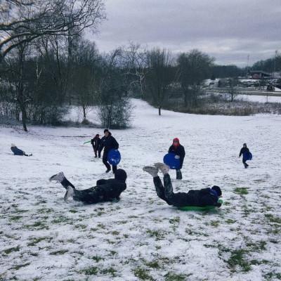 Sledding with the softball team only a quick walk away from campus!